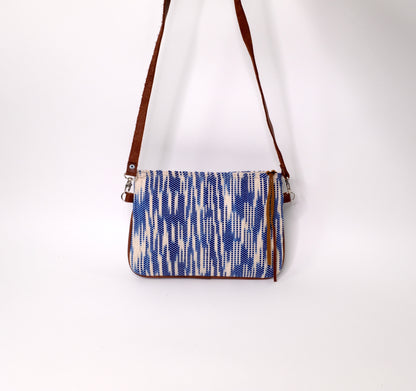 Crossbody Bag is composed of handwoven cotton fabric with light blue pattern and a detachable natural leather strap.