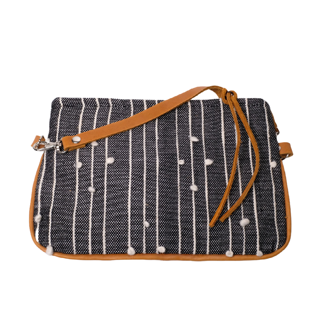 Crossbody Bag is composed of handwoven cotton fabric with black pattern and a detachable natural leather strap.