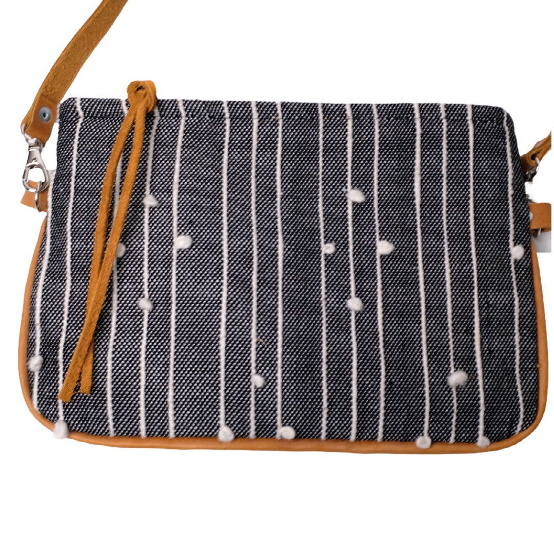 Crossbody Bag is composed of handwoven cotton fabric with black pattern and a detachable natural leather strap.