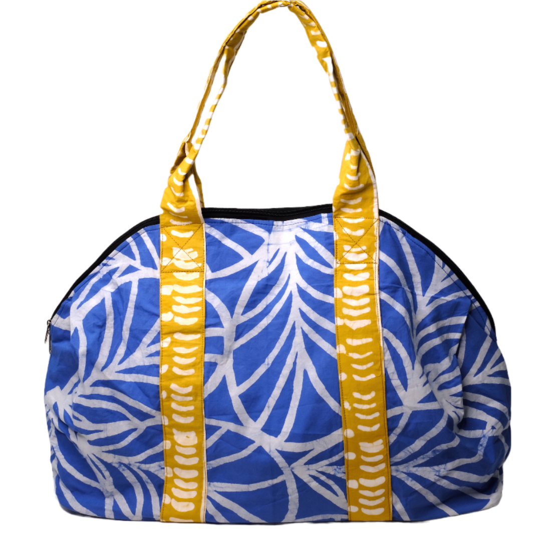 Large zippered weekend bag with a blue plant pattern and yellow straps