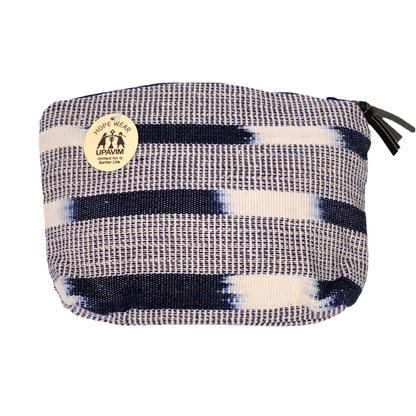 A small bag made with hand-woven fabric and ikat pattern.