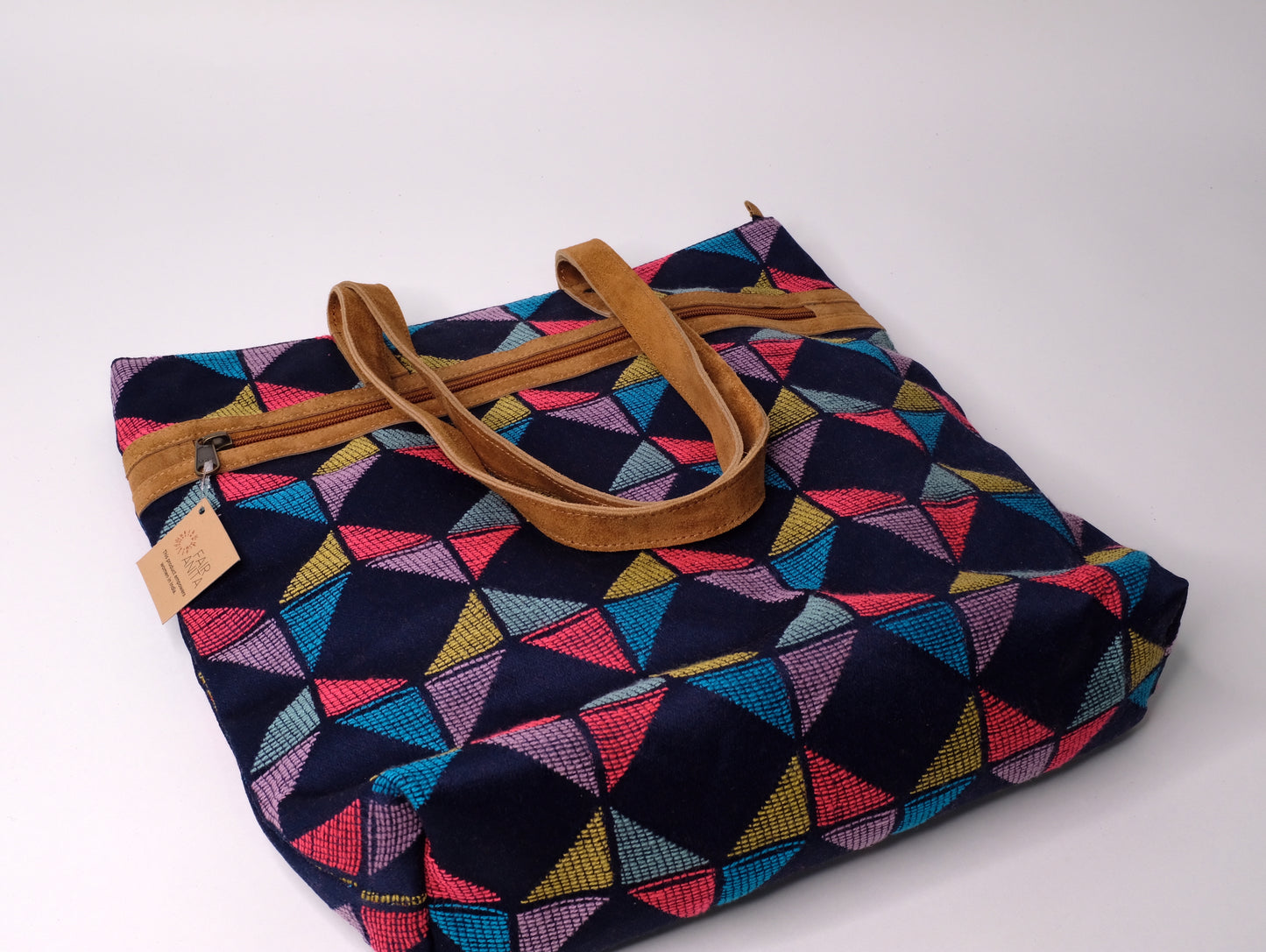 Tote bag crafted from recycled fabric and suede.Tote bag crafted from recycled fabric and suede.
