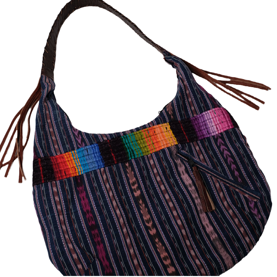 Blue handbag made with recycled Guatemala textiles, embroidery and leather fringe. Laying flat