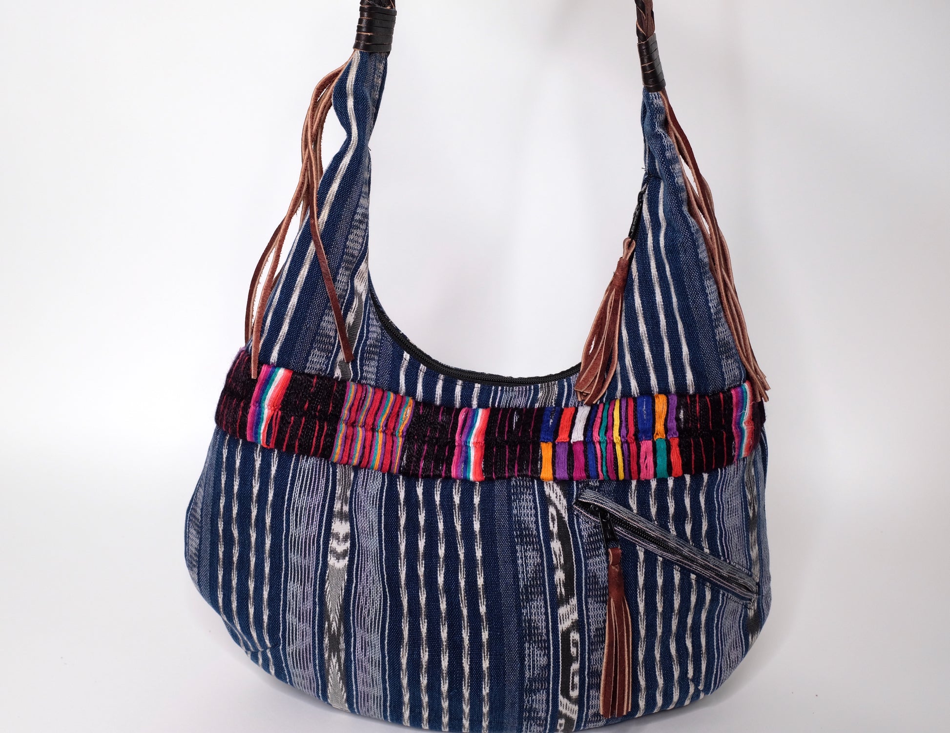 Blue handbag made with recycled Guatemala textiles, embroidery and leather fringe.